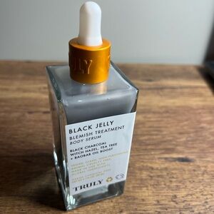 TRULY Gray Bottle with Orange-Gold Dropper Black Jelly Blemish Treatment Serum